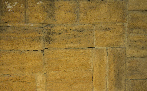 质朴的黄色老垃圾砖墙壁石头复古纹理背景包含位置