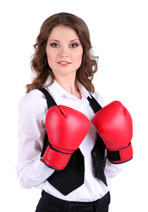 美丽的年轻商业女人与拳击手套上白色隔离