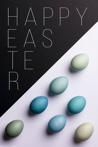 复活节快乐黑白背景。手绘蓝复活节彩蛋抽象极小概念