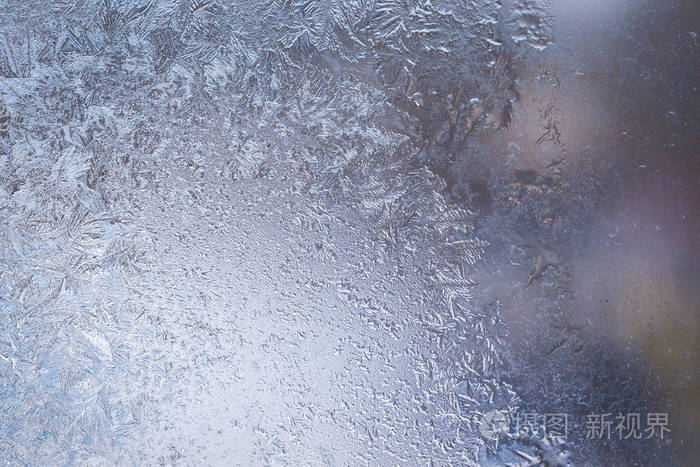 冰冻的窗户上的冬天结冰的图案纹理用于插入文本的背景新年主题冬天冷