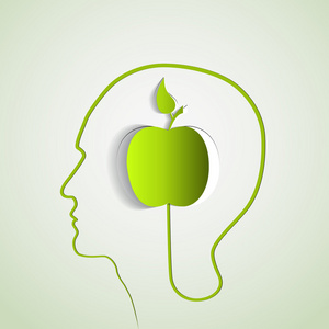 人体头部与纸绿色苹果