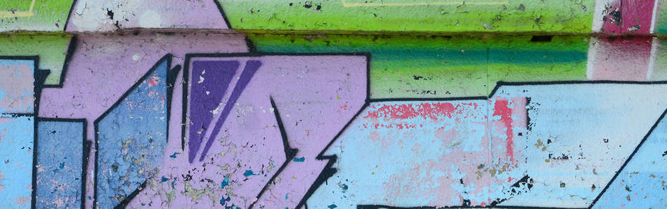 涂鸦画碎片。在街头艺术文化的风格上装饰着漆渍的旧墙。彩色背景纹理在冷色调