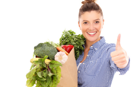 幸福的女人,与表现好的蔬菜照片