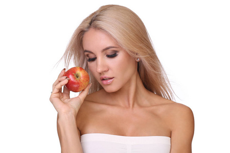 金发女人吃红苹果
