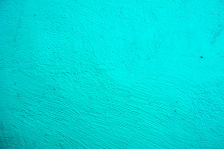 墙上画的蓝色纹理。淡绿色混凝土墙体的无缝纹理。抽象背景