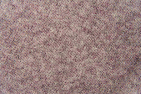 质地的粉红色编织羊毛针织毛衣。面料背景