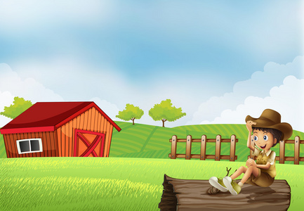 一个男孩坐在一个木房子与木材的农场