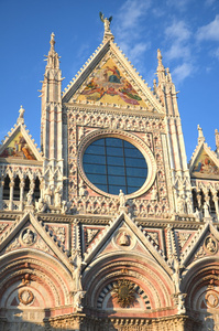 Faade of magnificent marble cathedral in Siena, Italy