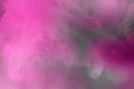 粉红色的水彩油漆在纸抽象的背景