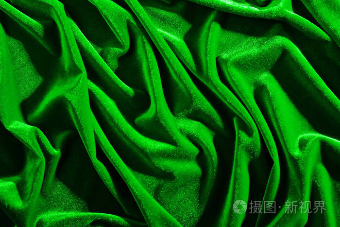 背景或质地皱纹和阴影的绿色天鹅绒纺织品