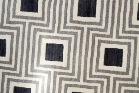 纹理或背景的地毯上美丽的几何正方形图案