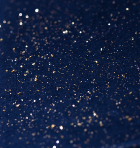 新年背景宇宙银河夜空概念性图像与金色的星星闪闪发光的黑暗背景照片