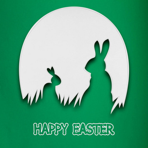 创意复活节概念照片的两只兔子在绿色背景上的纸制成的蛋