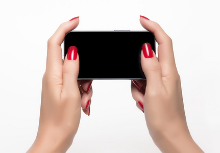 优雅的女人手里拿着一部智能手机照片