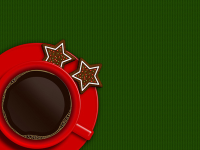 圣诞杯咖啡和饼干躺在绿色的台布
