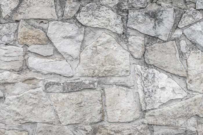 老花岗岩石头.一座古老的石墙.石墙的质地.