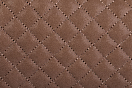 淡棕色绗缝的皮革特写照片