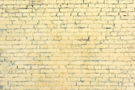 黄色砖墙从看不见的行。空白背景。砌体质地