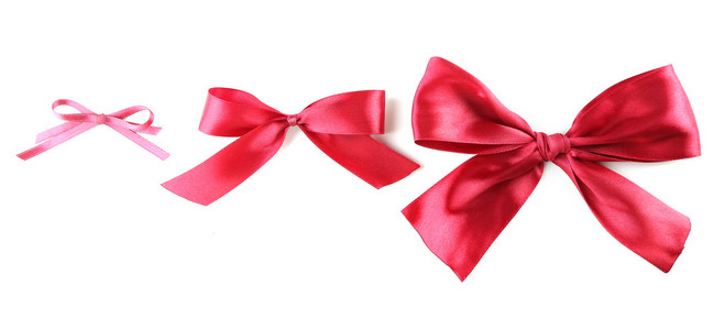 辫子缎带礼物缎带蝴蝶结,孤立的白色衬底上的颜色照片
