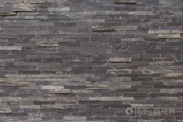 黑色的石板墙纹理和背景