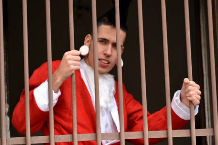 圣诞老人请在这儿停圣诞老人是在监狱的铁窗照片