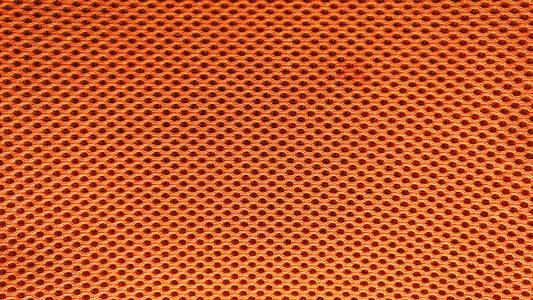 橙色尼龙织物花纹纹理背景照片