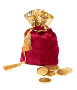 散落的欧元金币红色的袋子和欧元巧克力金币照片