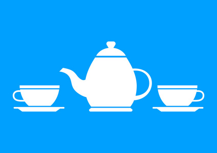 白色的茶壶和茶杯上蓝色背景