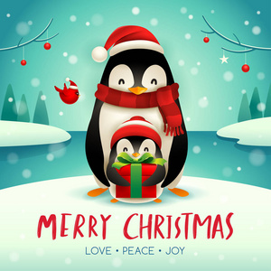 成年企鹅和小企鹅在圣诞节雪场面