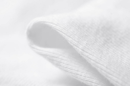 白色温暖的织物纹理材料毛衣上模糊的背景