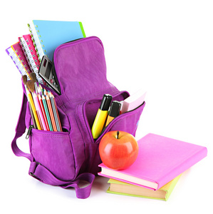 紫色背包和学校用品上白色孤立