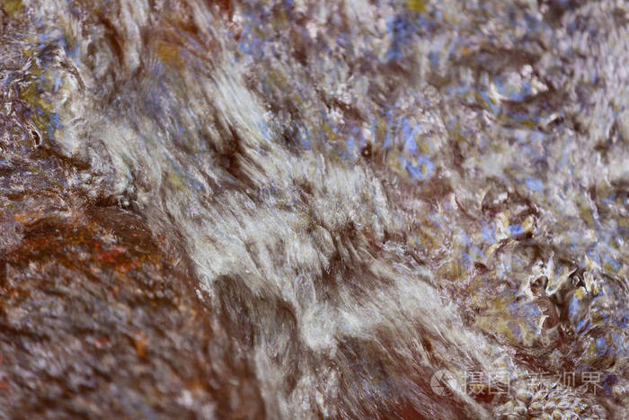 一个纹理的背景与抽象的外观创建的漩涡水在河床上