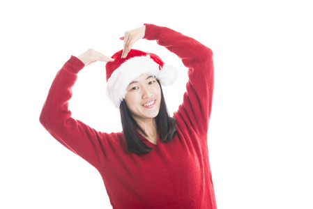 年轻的亚裔女子和孤立在白色的圣诞帽子
