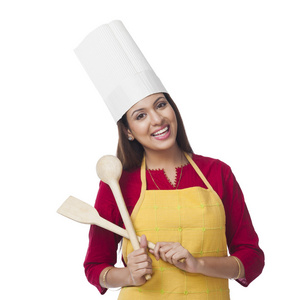 铲人幸福的女人,拿着锅铲和钢包照片