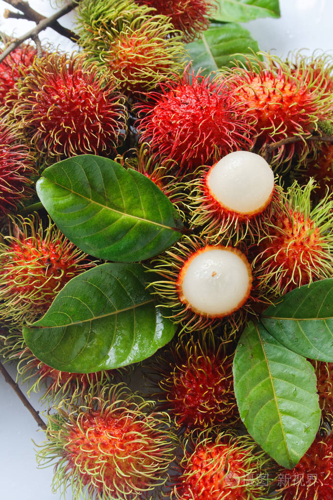 绿叶鲜红毛丹照片-正版商用图片08qfal-摄图新视界