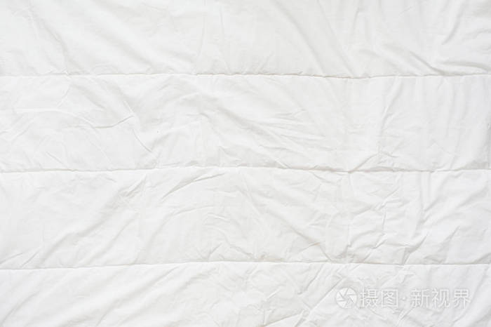 皱巴巴的被子白色毛毯纹理.特写
