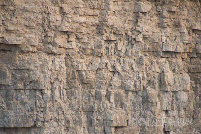 特写的石灰岩岩石表面显示风化岩层和地质 walpaper 或背景的细节.