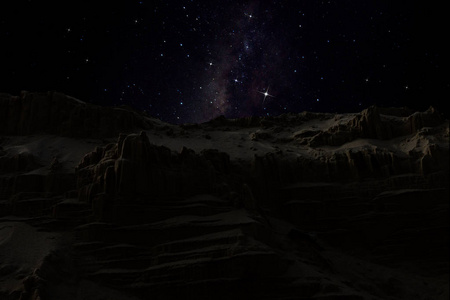 低密钥图像砂山与夜空和星背景