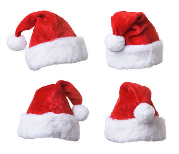 在白色背景查出的圣诞老人的红色帽子的汇集