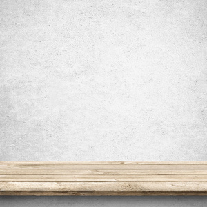张木桌和白色混凝土墙