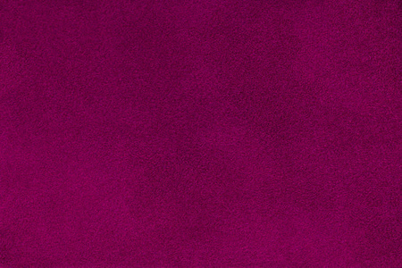 深色紫色哑光背景的绒面革面料, 特写镜头。天鹅绒纹理的无缝葡萄酒皮革。毛毡 m宏