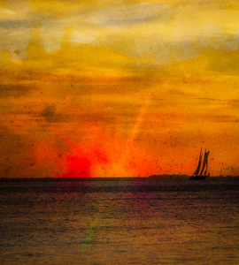 基韦斯特佛罗里达日落与炽热的夕阳和一艘帆船在地平线上