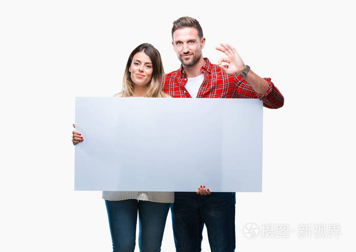 年轻夫妇一起持有空白横幅在孤立的背景做 ok 符号与手指, 优秀的符号
