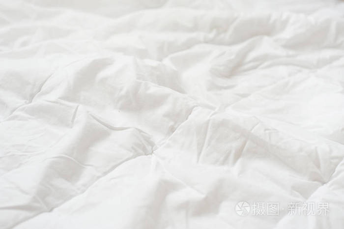 皱巴巴的被子白色毛毯纹理.特写