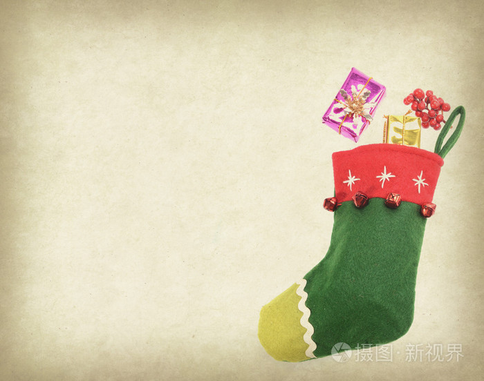 圣诞节袜子和带有旧纸张背景框