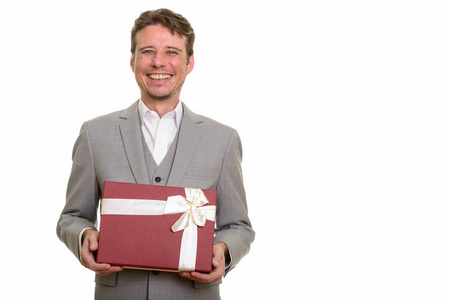 拿着礼物盒准备情人节的快乐高加索商人