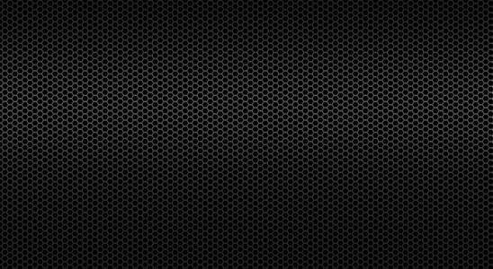 穿孔金属板的黑色背景照片