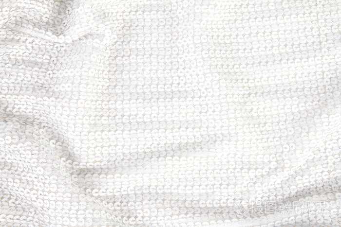 从白色闪亮亮片纺织的抽象背景