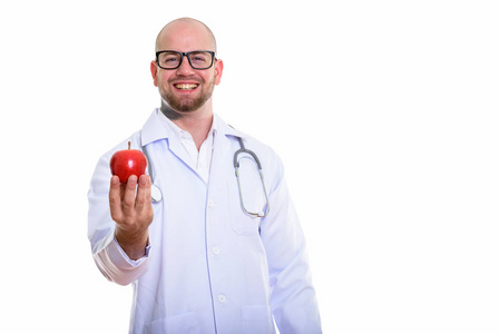 工作室拍摄的年轻秃头肌肉男医生照片