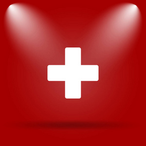 医学十字图标。红色背景上的平面图标